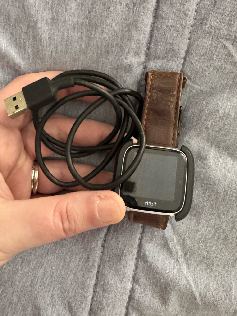 fitbit Versa Smartwatch with Brown Leather Band and Black Face